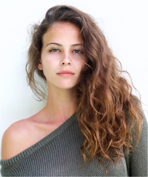 attractive-confident-woman-standing-against-white-PX2A5SQ