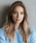 pretty-woman-standing-over-grey-wall-background-4A829TX