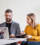 two-business-people-with-wheelchair-in-the-office-PMJT9V5-cropped
