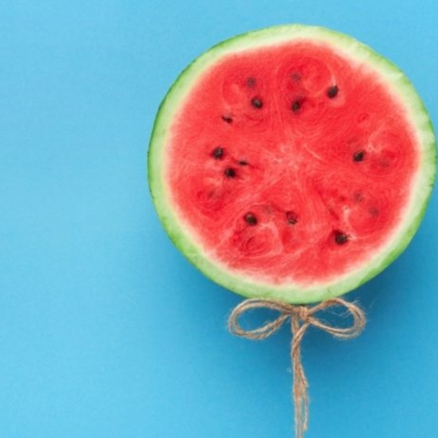 watermelon-balloon-on-blue-background-creative-57PNH8Q-607x464
