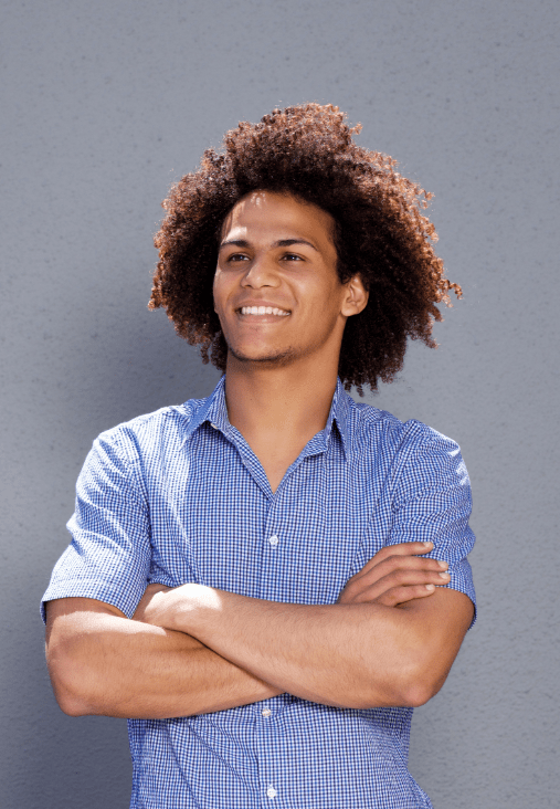 smiling-confident-man-standing-with-arms-crossed-DMBEGAW