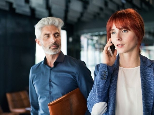 business-people-in-the-office-making-a-phone-call-PQZTHDY-637x478