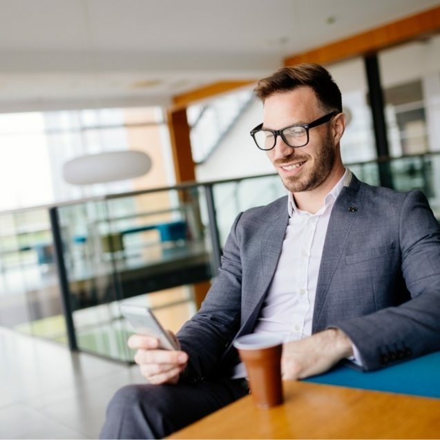 businessman-taking-a-break-with-a-cup-of-coffee-JW4B3DH-637x637