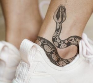 demo-attachment-195-closeup-of-ankle-tattoo-of-a-woman-PJMLBNC1